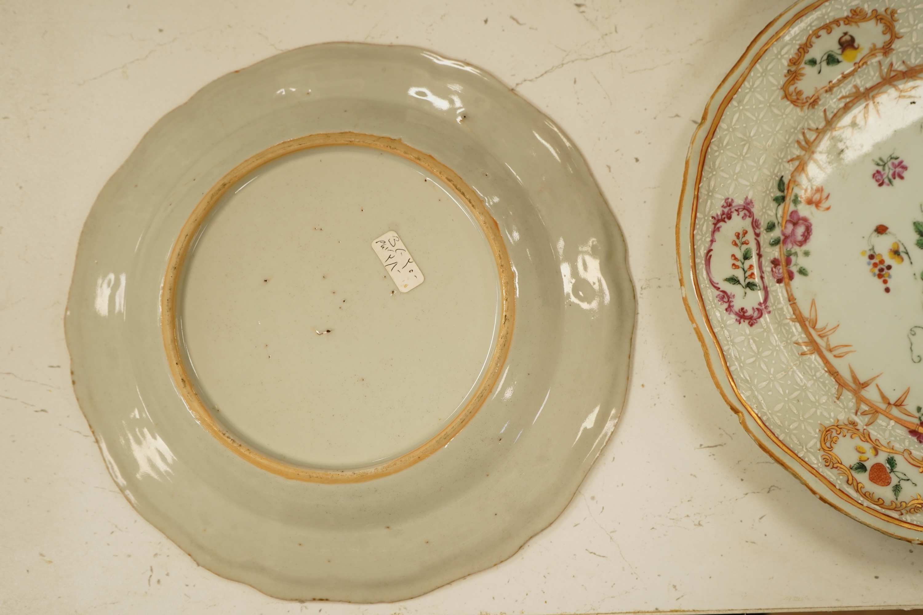 A pair of 18th century Chinese famille rose and bianco-sopra-bianco plates, 24cm